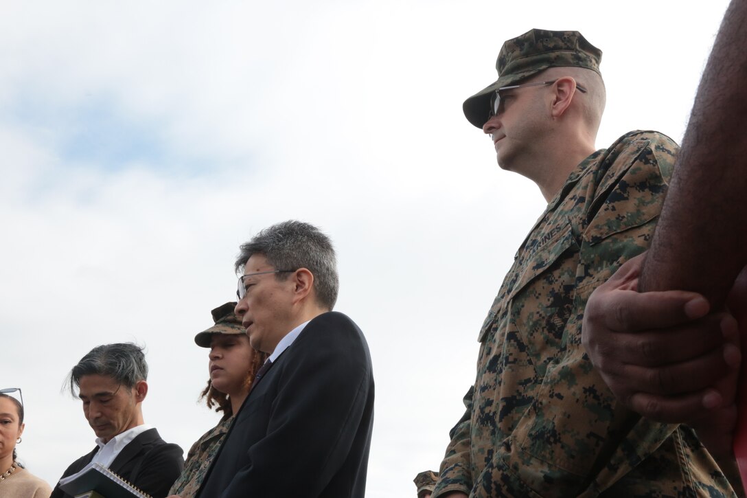 Masaki Yasudome, director for Crisis Management in Okinawa, second from right, and Lt. Col. John Roach, provost marshal, Provost Marshal's Office, right, receive questions from 15 media agencies.