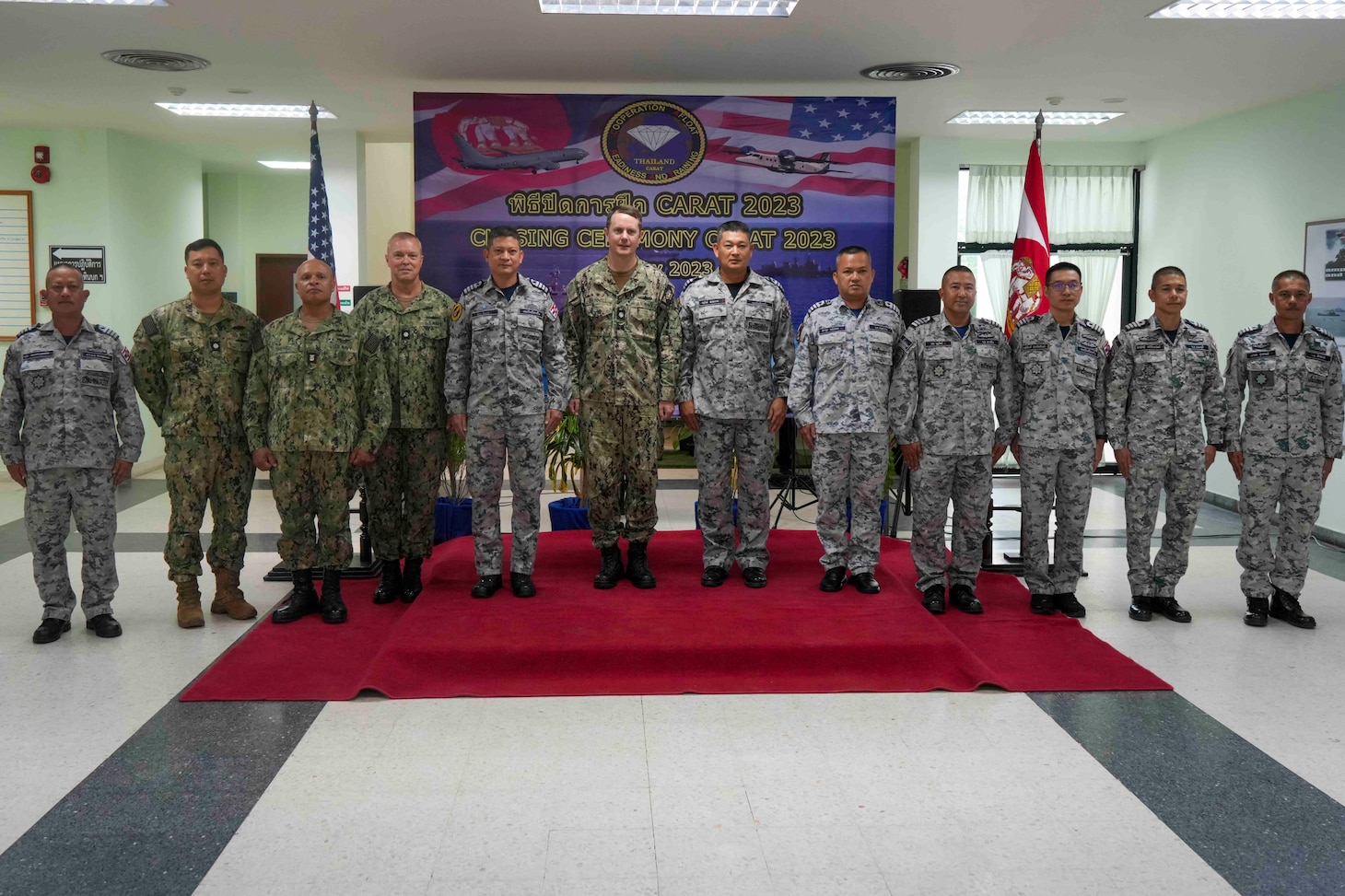 U.S. and Royal Thai Navy Sailors pose for a photo during the closing ceremony of Cooperation Afloat Readiness and Training (CARAT)/Marine Exercise (MAREX) Thailand 2023 at Royal Thai Fleet Headquarters, May 15. CARAT/MAREX Thailand is a bilateral exercise between the Kingdom of Thailand and United States to promote regional security cooperation, practice humanitarian assistance and disaster relief, and strengthen maritime understanding, partnerships and interoperability. Thailand has been part of the CARAT exercise series since 1995. In its 29th year, the CARAT series is comprised of multinational exercises, designed to enhance U.S. and partner forces’ abilities to operate together in response to traditional and non-traditional maritime security challenges in the Indo-Pacific region.