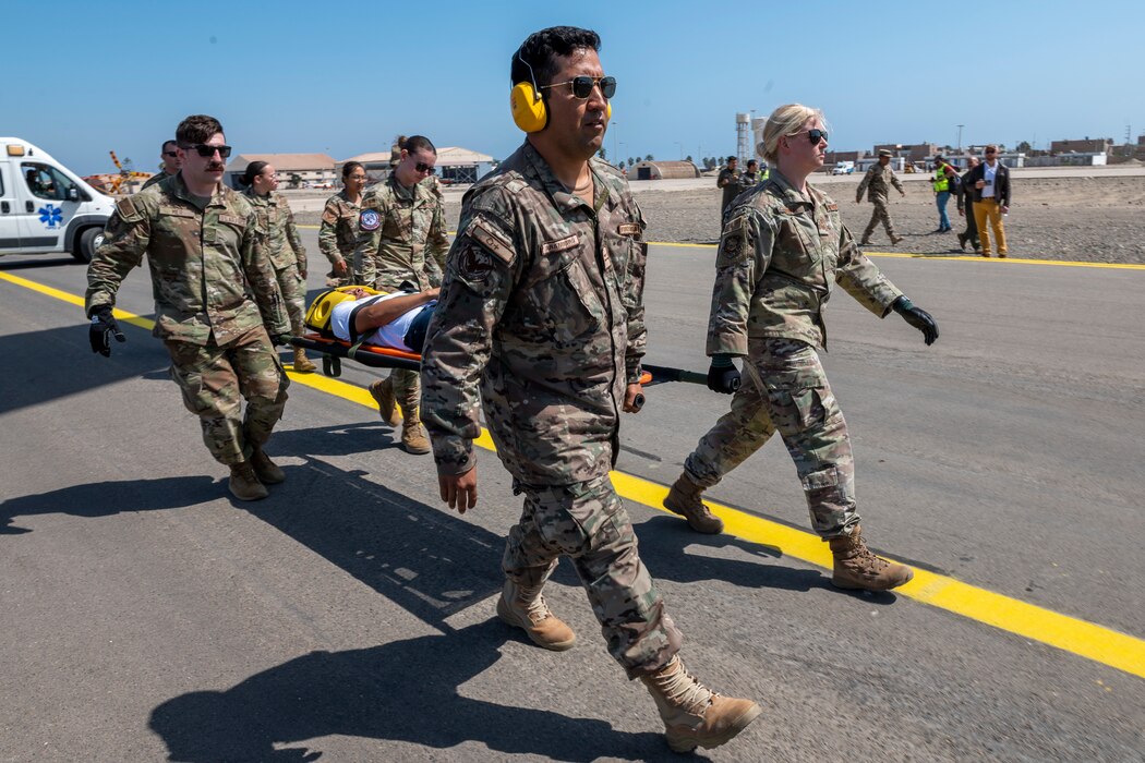 Image of a group of Airmen training with a patient on a stretcher.
