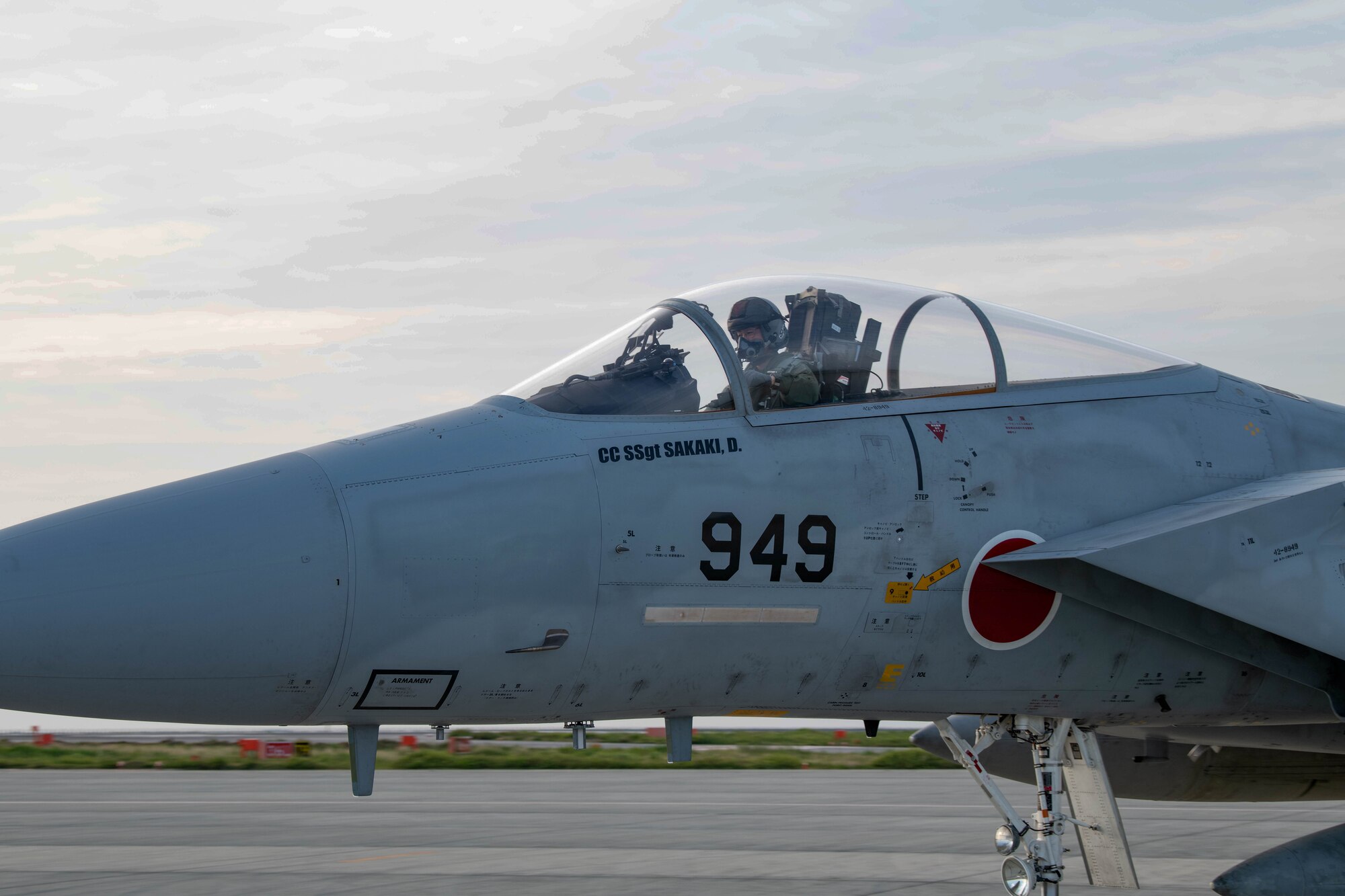 Japanese pilot waves from the cockpit before take off