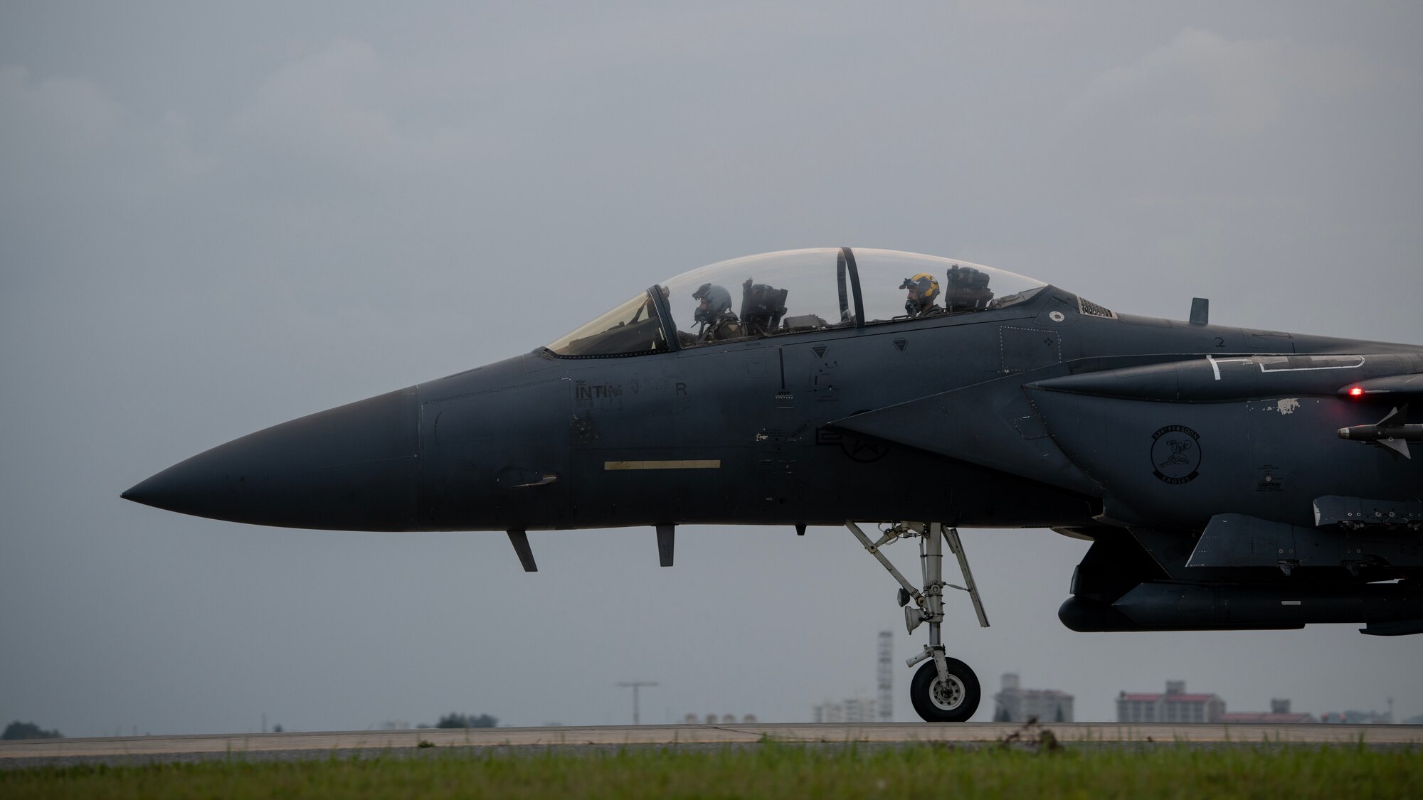 An F-15E Strike Eagle assigned to the 336th Fighter Squadron taxis down the flightline at Kadena Air Base, Japan, May 17, 2023. Night Flying exercises provide fighter squadron aircrew and support personnel the experience needed to maintain a ready force capable of ensuring the collective defense of the Indo-Pacific region. (U.S. Air Force photo by Staff Sgt. Jessi Roth)