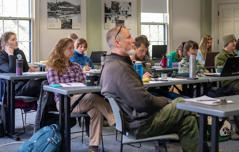 Attendees listening to a lecture in a classroom.