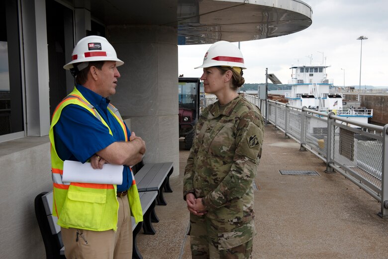 Mike Looney, U.S. Army Corps of Engineers Nashville District Eastern Kentucky Area manager, briefs Brig. Gen. Kimberly Peeples, Great Lakes and Ohio River Division commanding general, during a tour of the navigation lock during the Ohio River Basin Inspection Tour May 23, 2023, on the Tennessee River in Grand Rivers, Kentucky. The U.S. Army Corps of Engineers Nashville District operates and maintains the navigation lock at the Tennessee Valley Authority project. (USACE Photo by Lee Roberts)