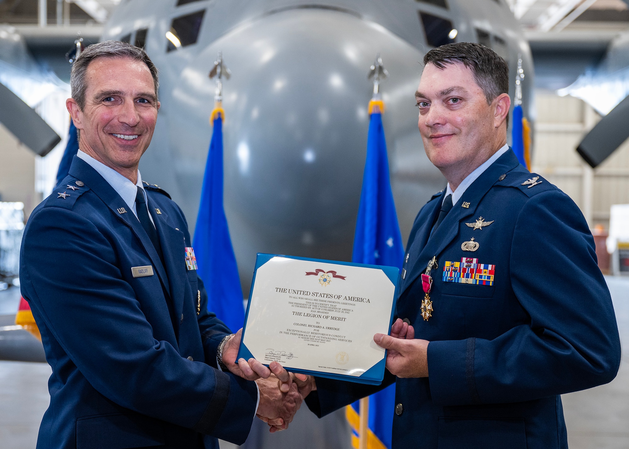 Col. Richard A. Erredge receives the Legion of Merit from Maj. Gen. Bryan P. Radliff during the 960th Cyberspace Wing change of command ceremony at Joint Base San Antonio-Lackland, Texas on May 7, 2023. (U.S. Air Force photo by Brian Boisvert)