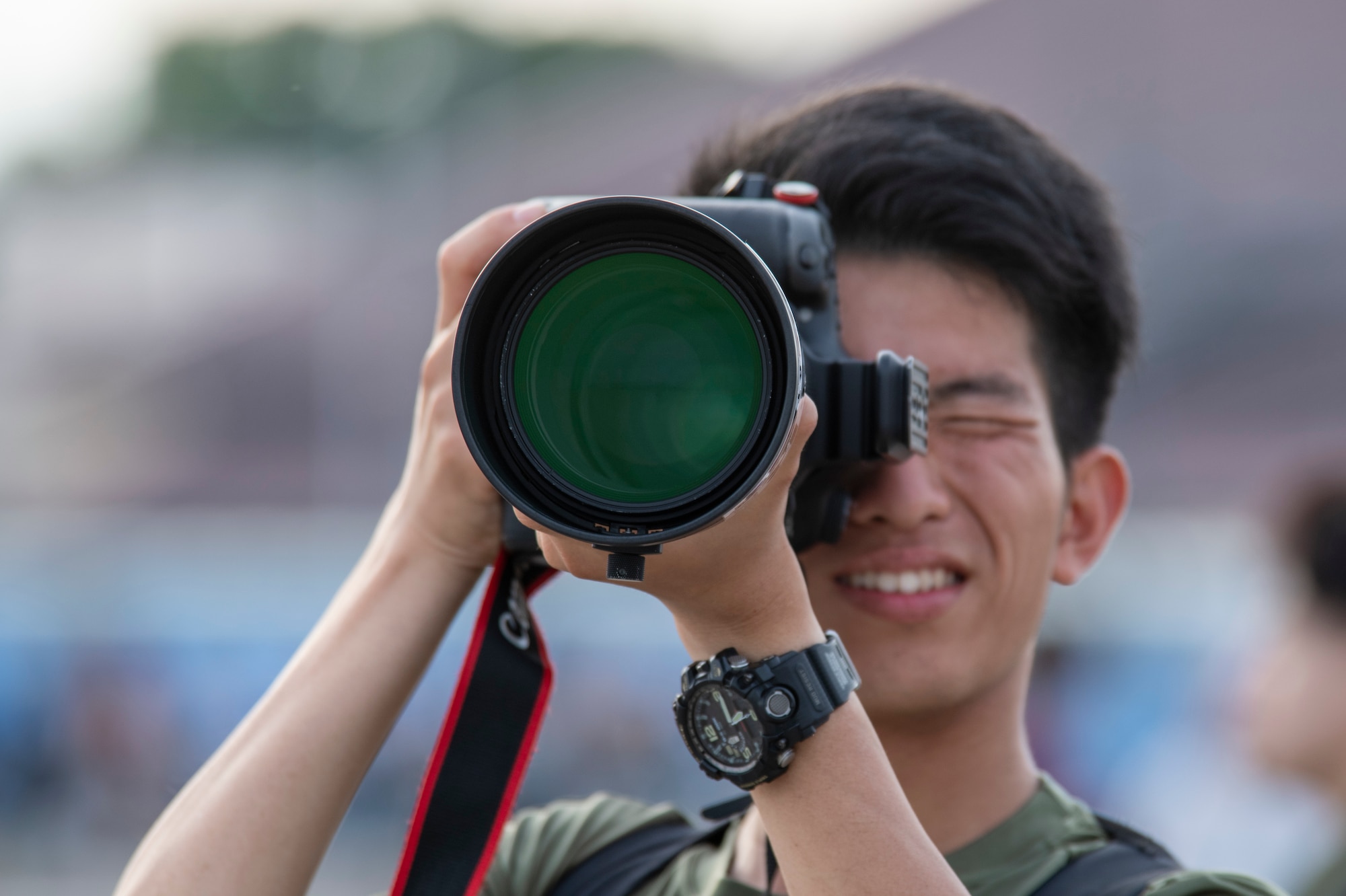 A man with a large camera take a picture