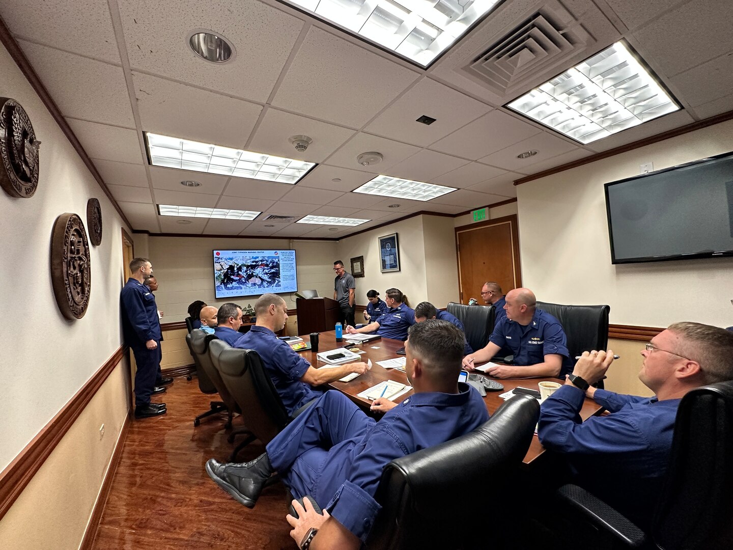 UU.S. Coast Guard Forces Micronesia Sector Guam crews hold a weather brief on May 22
