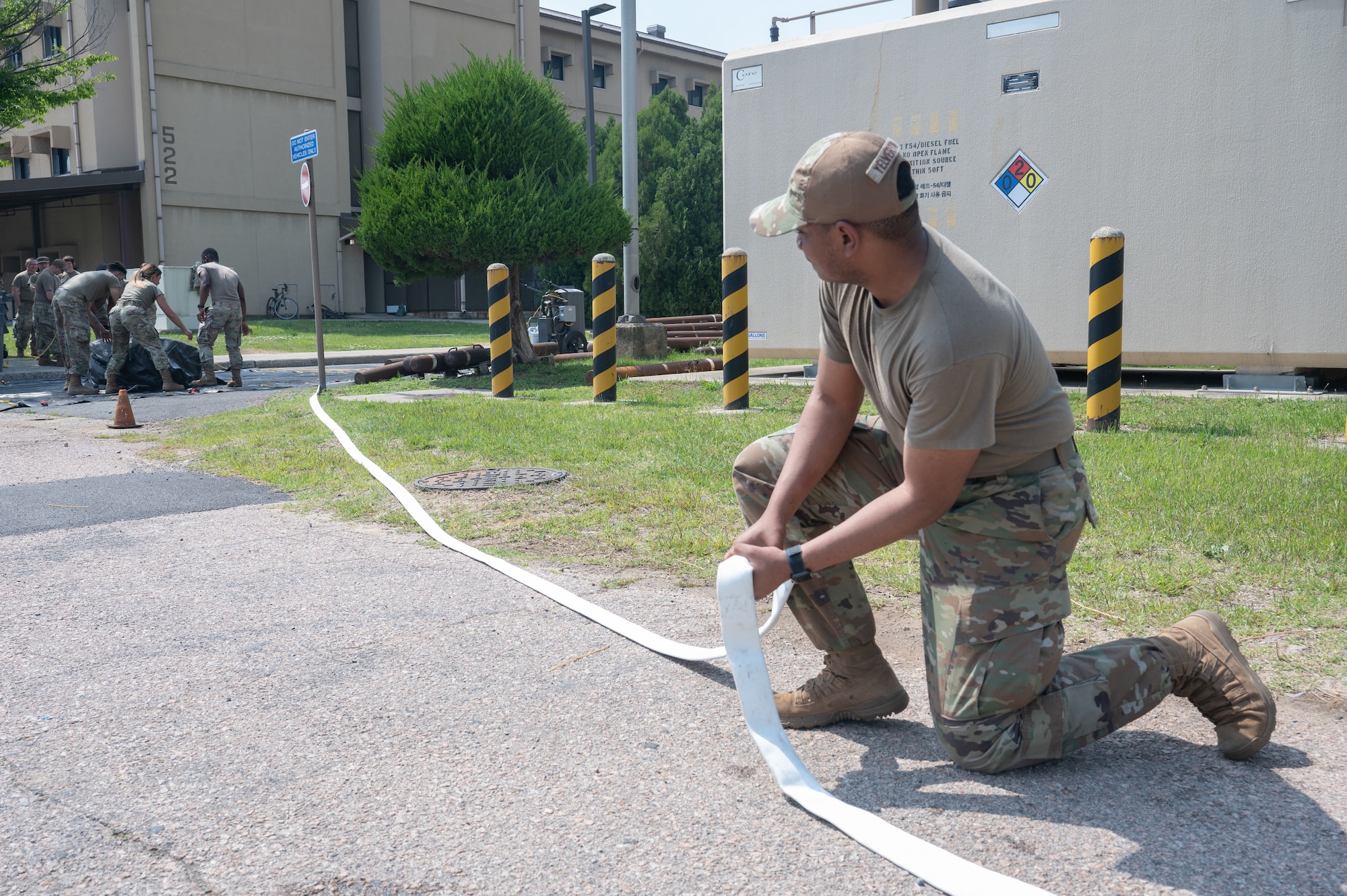 Airman secures water hose