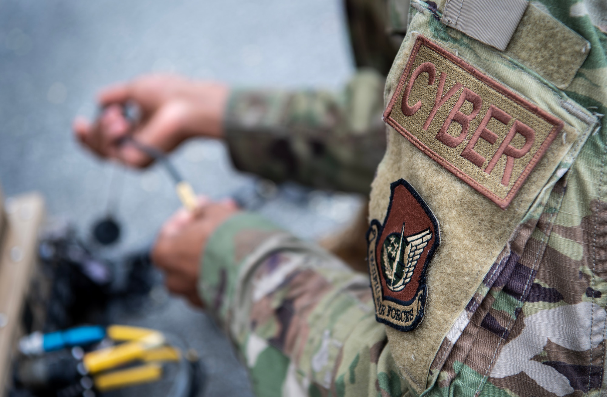 U.S. Air Force Staff Sgt. Christopher Florence, 607th Air Communications Squadron, NCO in charge of the radio satellite communications shop, sets up a Hawkeye antenna during exercise Enduring PACE, May 18, 2023, at Osan Air Base, Republic of Korea.