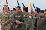 Brig. Gen. David Cochran, assistant adjutant general – air, West Virginia National Guard, greets Peruvian Air Force members after the opening ceremony of exercise Cooperation IX in Lima, Peru, May 8, 2023. Members of the the West Virginia Air National Guard participated in humanitarian assistance and disaster response exercise Cooperation IX, Peru 2023.