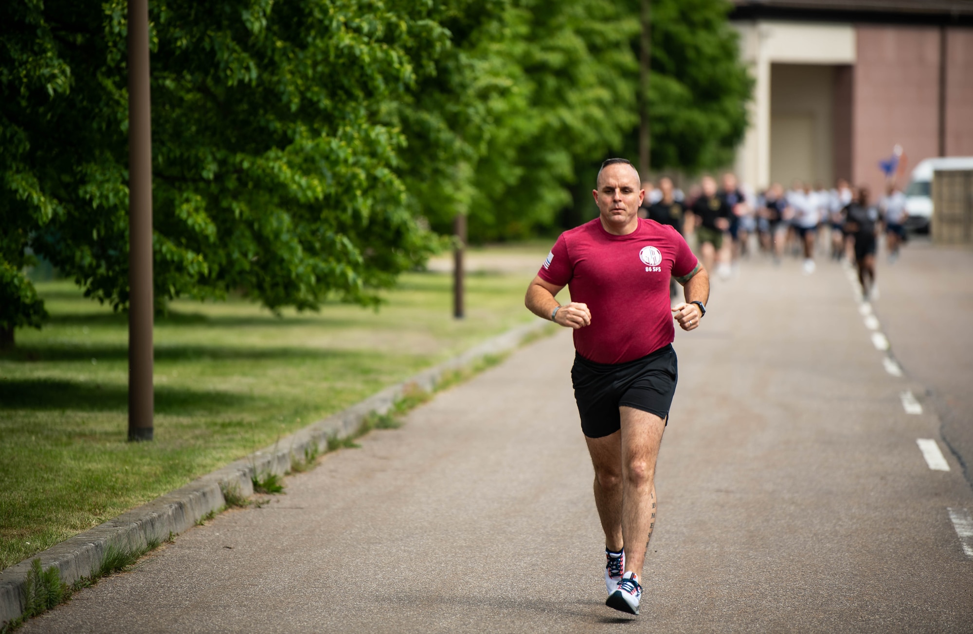 U.S. Air Force Chief Master Sgt. Chad VanCleave-Goff, 86th Security Forces Squadron senior enlisted leader, runs during a 5k memorial event during Police Week at Ramstein Air Base, Germany, May 15, 2023. During the week, the base held several events honoring Police Week including a Defender Challenge, 5K run and a final guardmount. (U.S. Air Force photo by Airman 1st Class Jared Lovett)