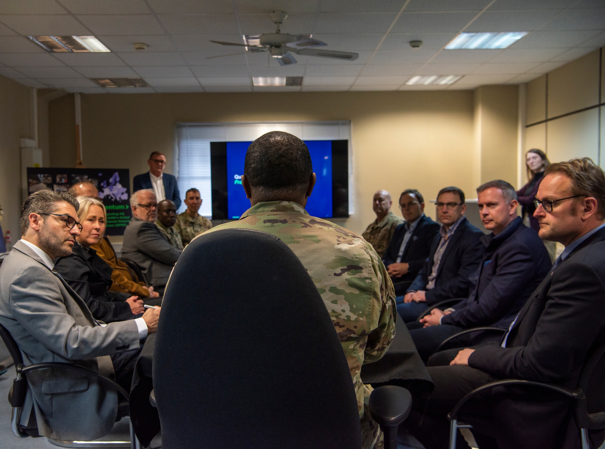 U.S. Air Force Brig. Gen. Otis C. Jones, 86th Airlift Wing commander, speaks with local German dignitaries during a tour of a storage facility in Pirmasens, Germany, May 12, 2023.