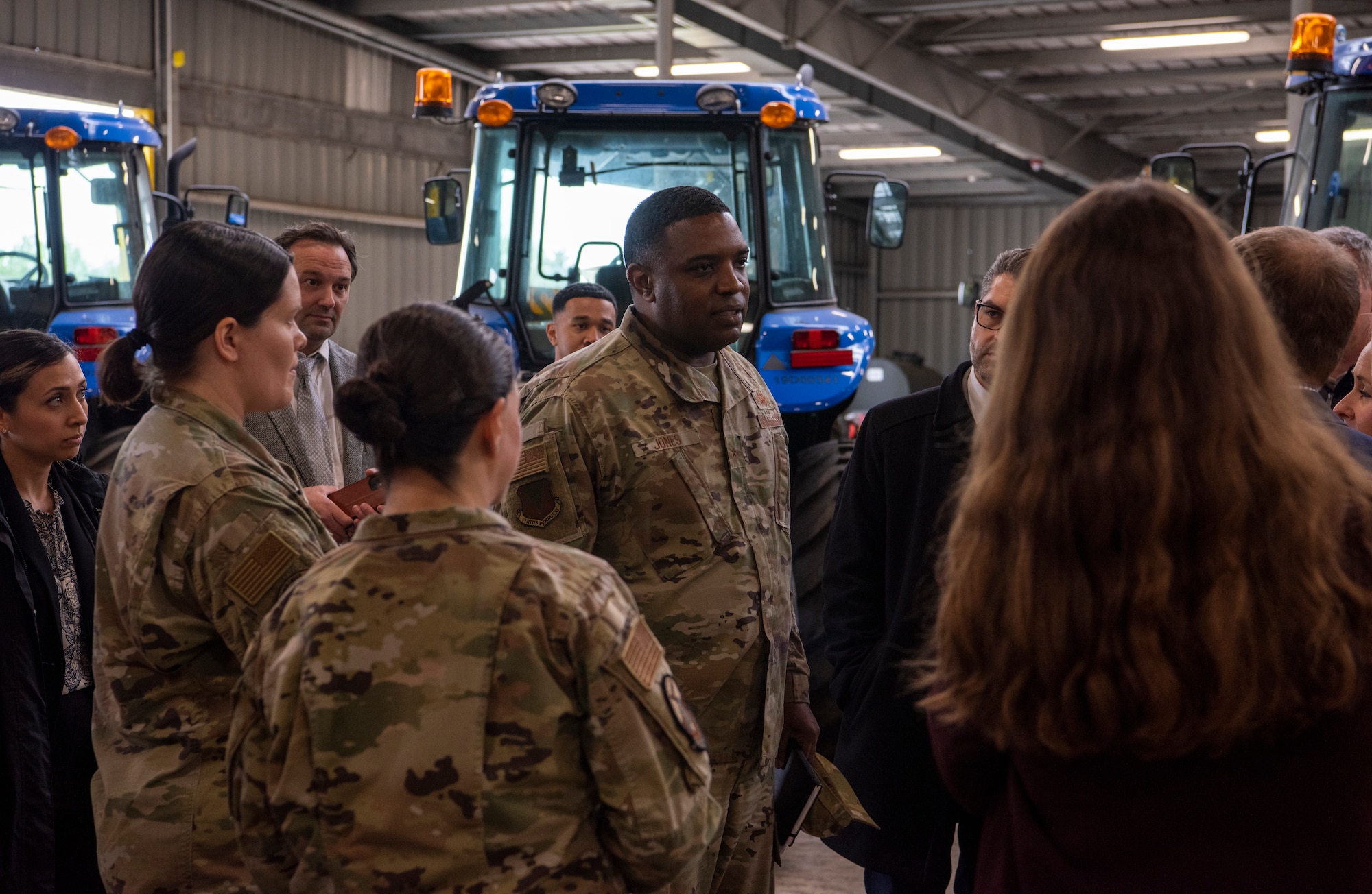 U.S. Air Force Brig. Gen. Otis C. Jones, 86th Airlift Wing commander, speaks with German dignitaries during a tour of a Department of Defense storage facility in Pirmasens, Germany, May 12, 2023.