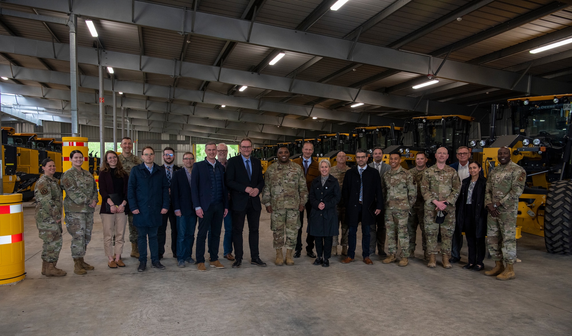 U.S. Air Force Brig. Gen. Otis C. Jones, 86th Airlift Wing commander, stands with civic leaders of the Kaiserslautern military community during a tour of a Department of Defense storage facility in Pirmasens, Germany, May 12, 2023.