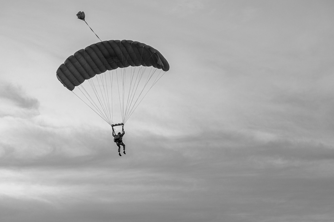 Marine Raiders with Marine Forces Special Operations Command conduct military freefall parachute training on Camp Lejeune, North Carolina, Mar. 8, 2023. MFF training ensures Marine Raiders maintain operational currency and capabilities to support global mission requirements. (U.S. Marine Corps photo by Cpl. Henry Rodriguez)  (This image was captured in color and changed to black-and-white.)