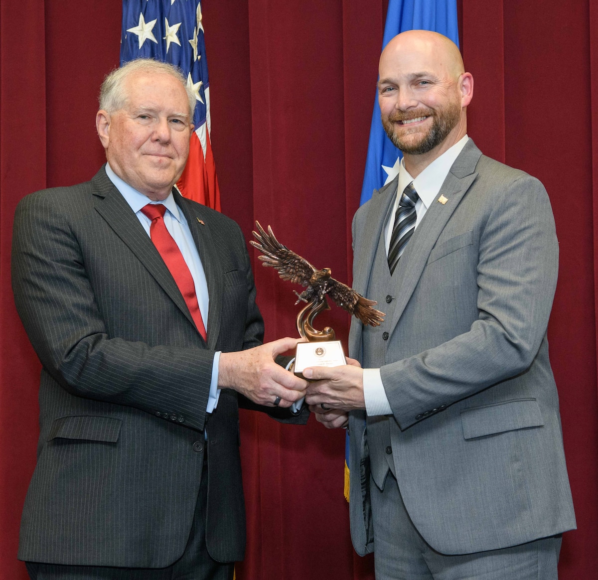 Secretary of the Air Force Frank Kendall presents a Secretary of the Air Force 2022 Leadership Award to William Tooke during a ceremony May 9, 2023