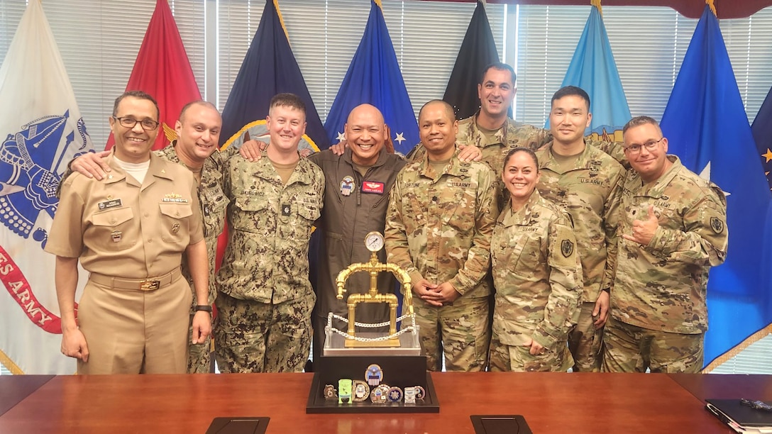 a large group of military officers pose for a photo