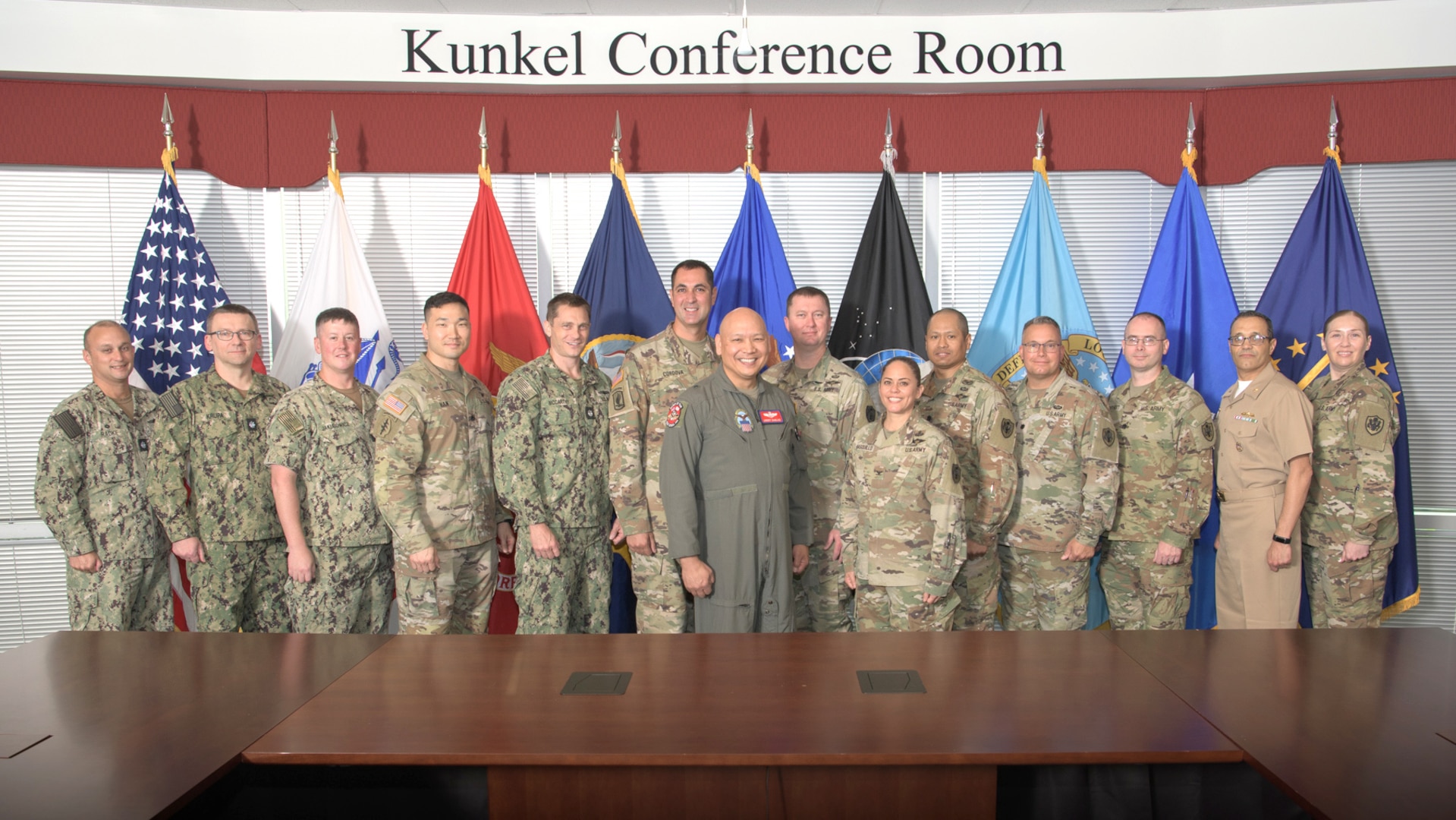 a large group of military officers pose for a photo