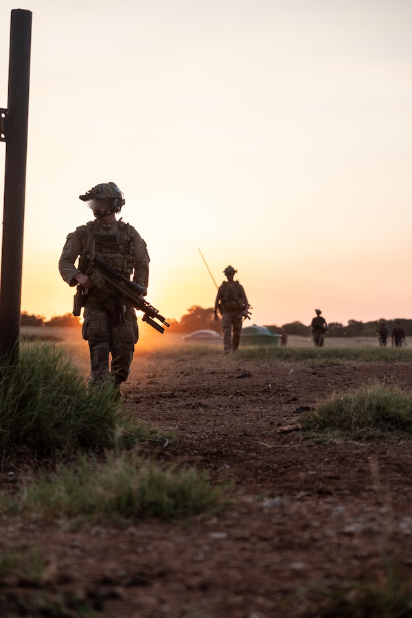 Explosive ordnance disposal technicians with Marine Forces Special Operations Command and Air Force Special Operations Command conduct a patrol alongside critical skills operators during a training event June 24, 2022. The EOD primer tests all aspects of a technician’s knowledge and expertise needed to perform as the only tech on a Marine Special Operations Team while operating in austere, politically sensitive, or hostile environments. EOD technicians assigned to MARSOC have completed Marine Special Operations Forces Explosive Ordnance Disposal Level 1, which trains Fleet Marine Force EOD technicians in the knowledge and skills required to support the core tasks assigned to MARSOC as a special operations capability specialist. (U.S. Marine Corps photo by Sgt. Brennan Priest)