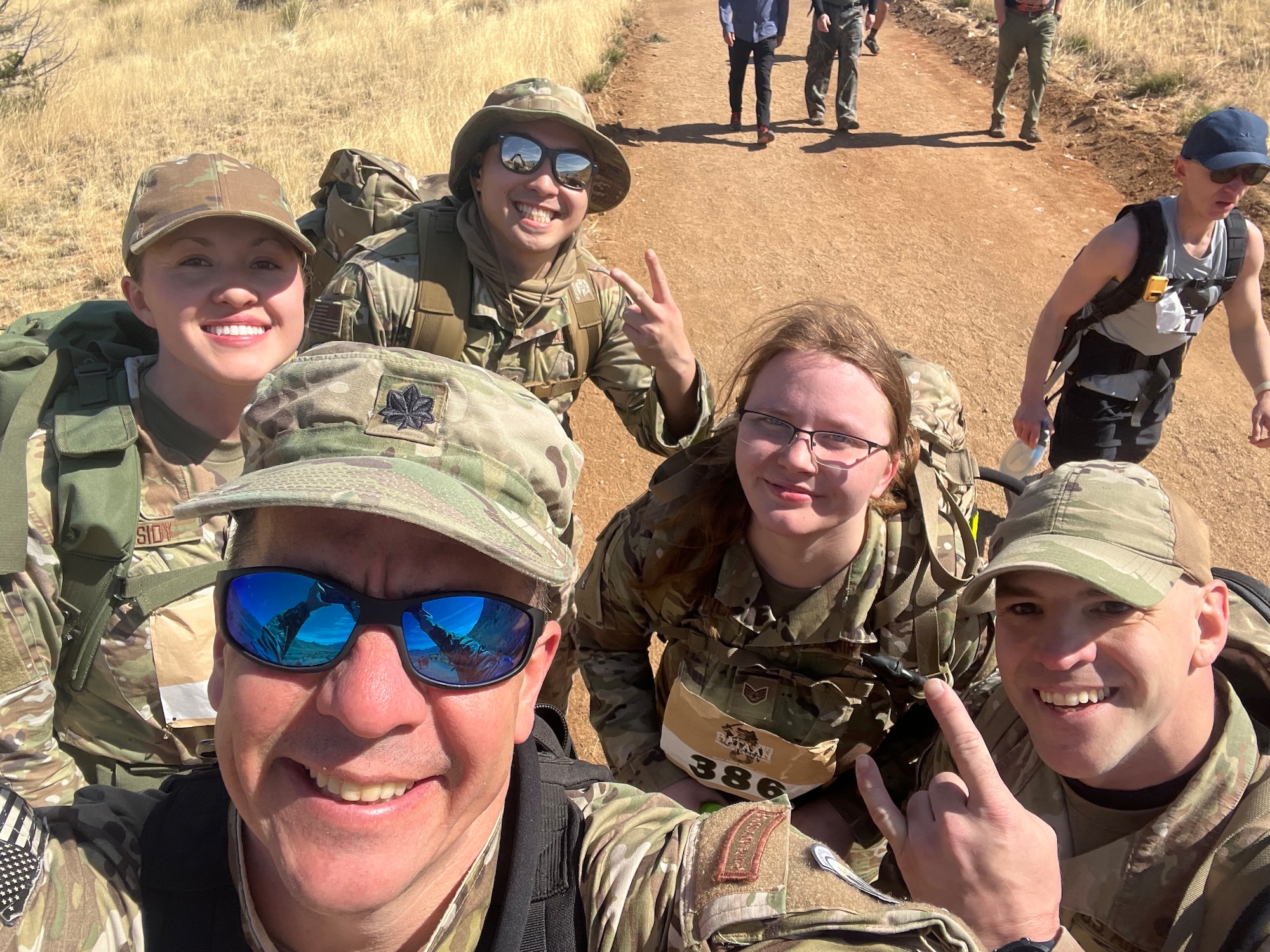 SrA Alexis Cassidy, TSgt Joshua Hurt, SSgt Misty Younce, TSgt David Eckstein, and  Lt. Col. William Selber current and former members of the 451st Intelligence Squadron, on the course of Bataan Memorial Death March.