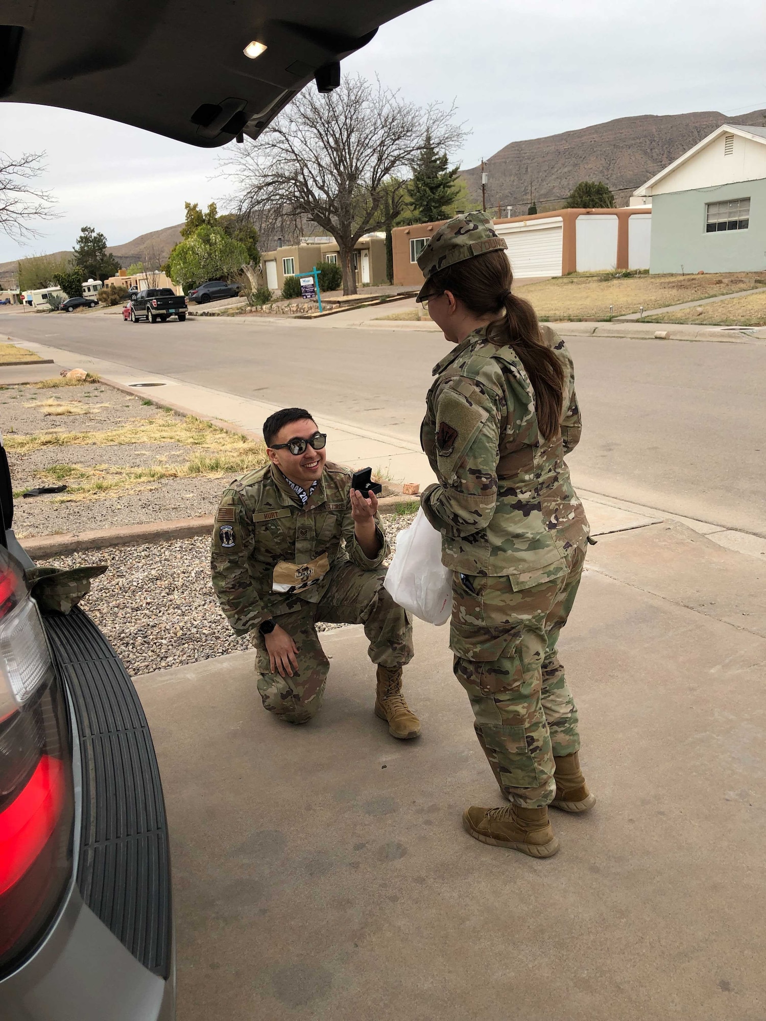 TSgt Joshua Hurt proposes to fiancé, SSgt Misty Younce in Alamogordo, New Mexico, after the Bataan Memorial Death March. She said, “Yes!”