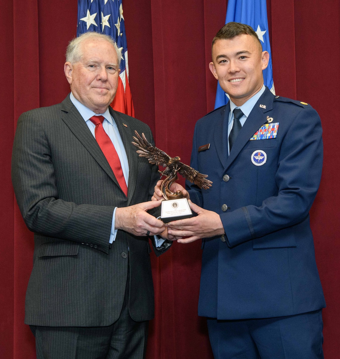 Secretary of the Air Force Frank Kendall presents a Secretary of the Air Force 2022 Leadership Award to Maj. Sergei McNulty