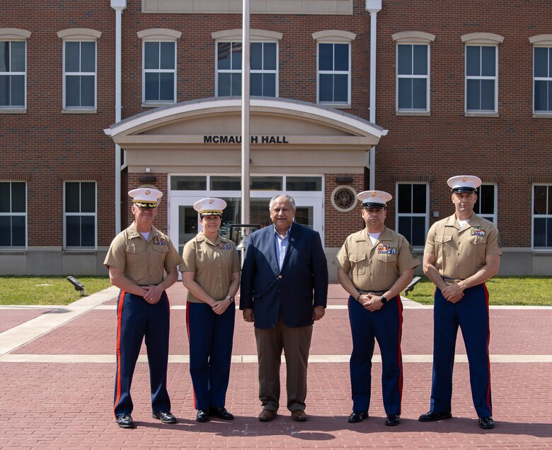 The Secretary of the Navy, the Honorable Mr. Carlos Del Toro, stands with the command team of Marine Corps Embassy Security Group for a group photo at its headquarters in Quantico, Va., May 19, 2023. Del Toro visited MCESG to award 12 Marines with Detachment Khartoum for their efforts in safely evacuating 75 embassy personnel from the U.S. Embassy in Khartoum amid surging conflict in Sudan. (U.S. Marine Corps photo by Sgt. Braden Hale)