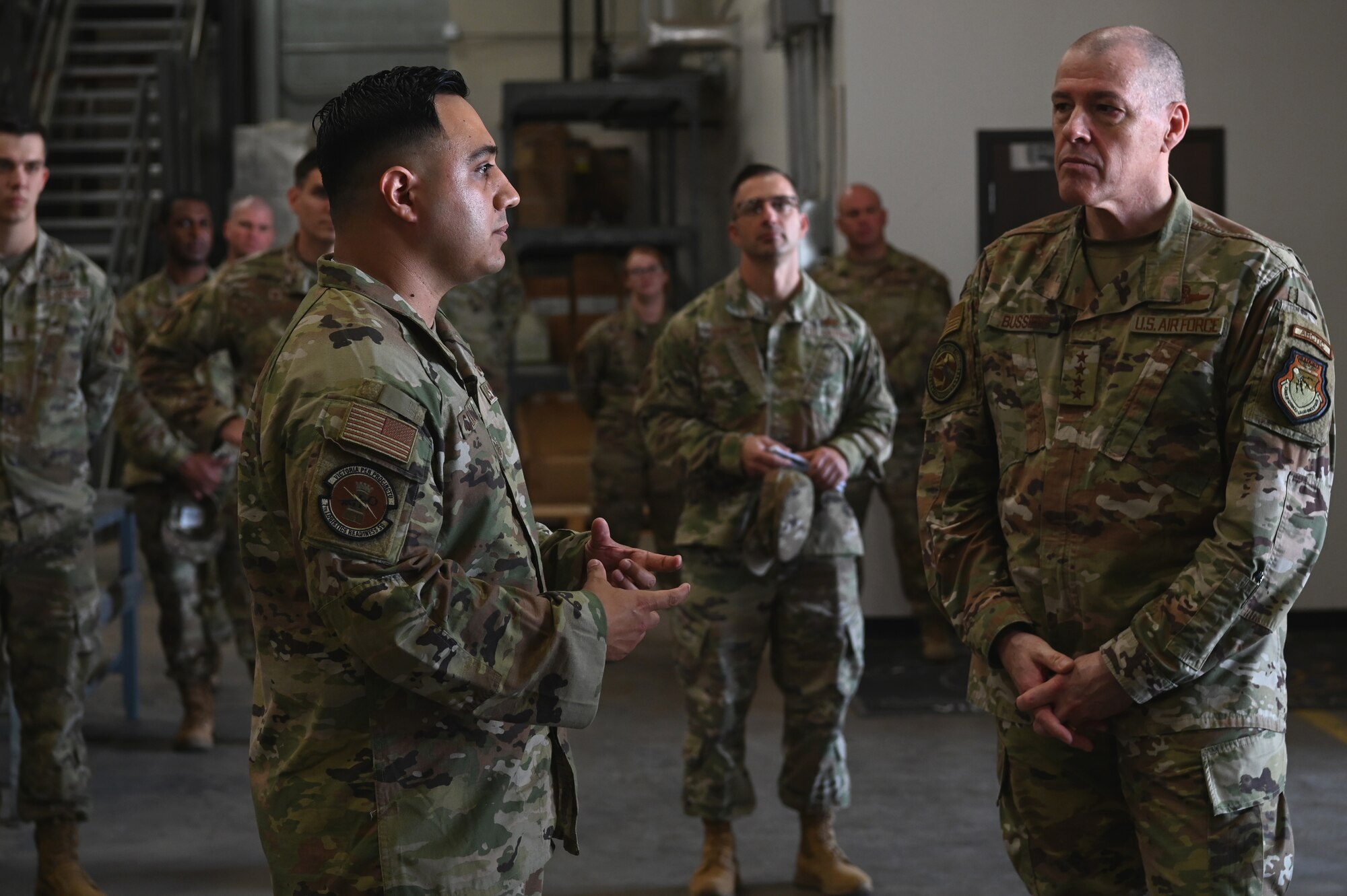Tech. Sgt. Aaron Garcia, 7th Logistics Readiness Squadron noncommissioned officer in charge of customer service and equipment, briefs Gen. Thomas Bussiere, Air Force Global Strike Command commander, on innovative supply techniques at Dyess Air Force Base, Texas, May 17, 2023. During a three day visit to the base, AFGSC leadership engaged with Dyess Airmen seeing how they accomplish both the global strike and mobility missions. (U.S. Air Force photo by Airman 1st Class Emma Anderson)