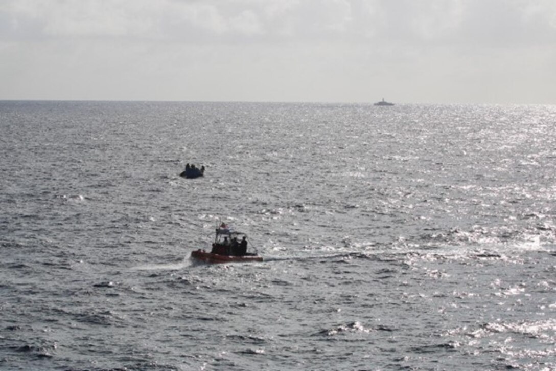 USCGC Confidence’s (WMEC 619) small boat crew converges on a Cuban migrant vessel in support of Operation Vigilant Sentry off the coast of Key West, Florida, Jan. 21, 2023. Confidence’s crew patrolled the Coast Guard’s Seventh District area of operations to conduct maritime safety and security missions. (U.S. Coast Guard photo by Petty Officer 1st Class Dehan Harris)