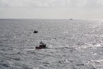 USCGC Confidence’s (WMEC 619) small boat crew converges on a Cuban migrant vessel in support of Operation Vigilant Sentry off the coast of Key West, Florida, Jan. 21, 2023. Confidence’s crew patrolled the Coast Guard’s Seventh District area of operations to conduct maritime safety and security missions. (U.S. Coast Guard photo by Petty Officer 1st Class Dehan Harris)