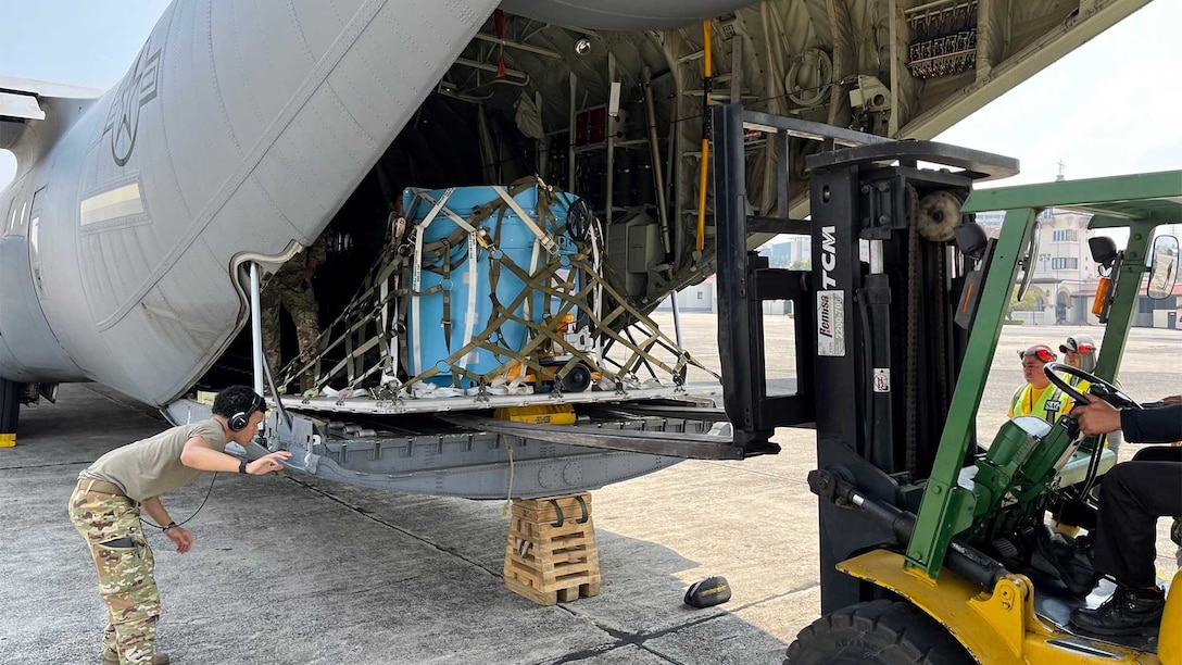 US Air Force C-130 crew loading the Cobalt-60 sources