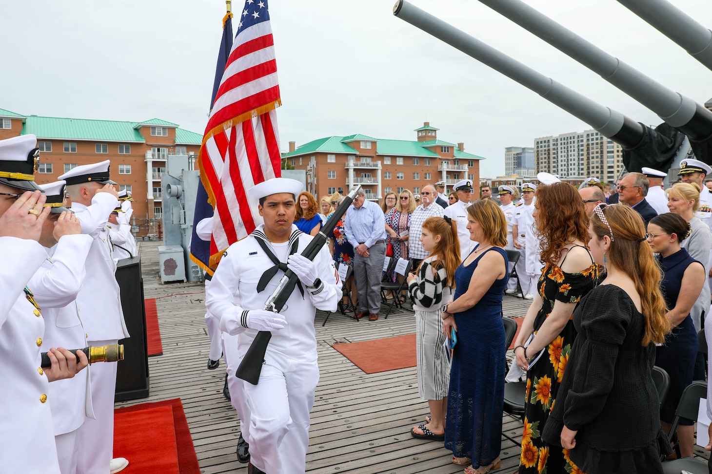 The color guard prepares to present colors during a change of command ceremony for the Virginia-class attack submarine USS John Warner (SSN 785) aboard the decommissioned Iowa-class battleship USS Wisconsin.