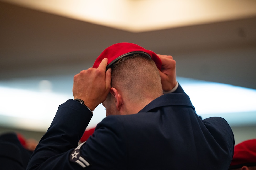 Airman puts on red beret