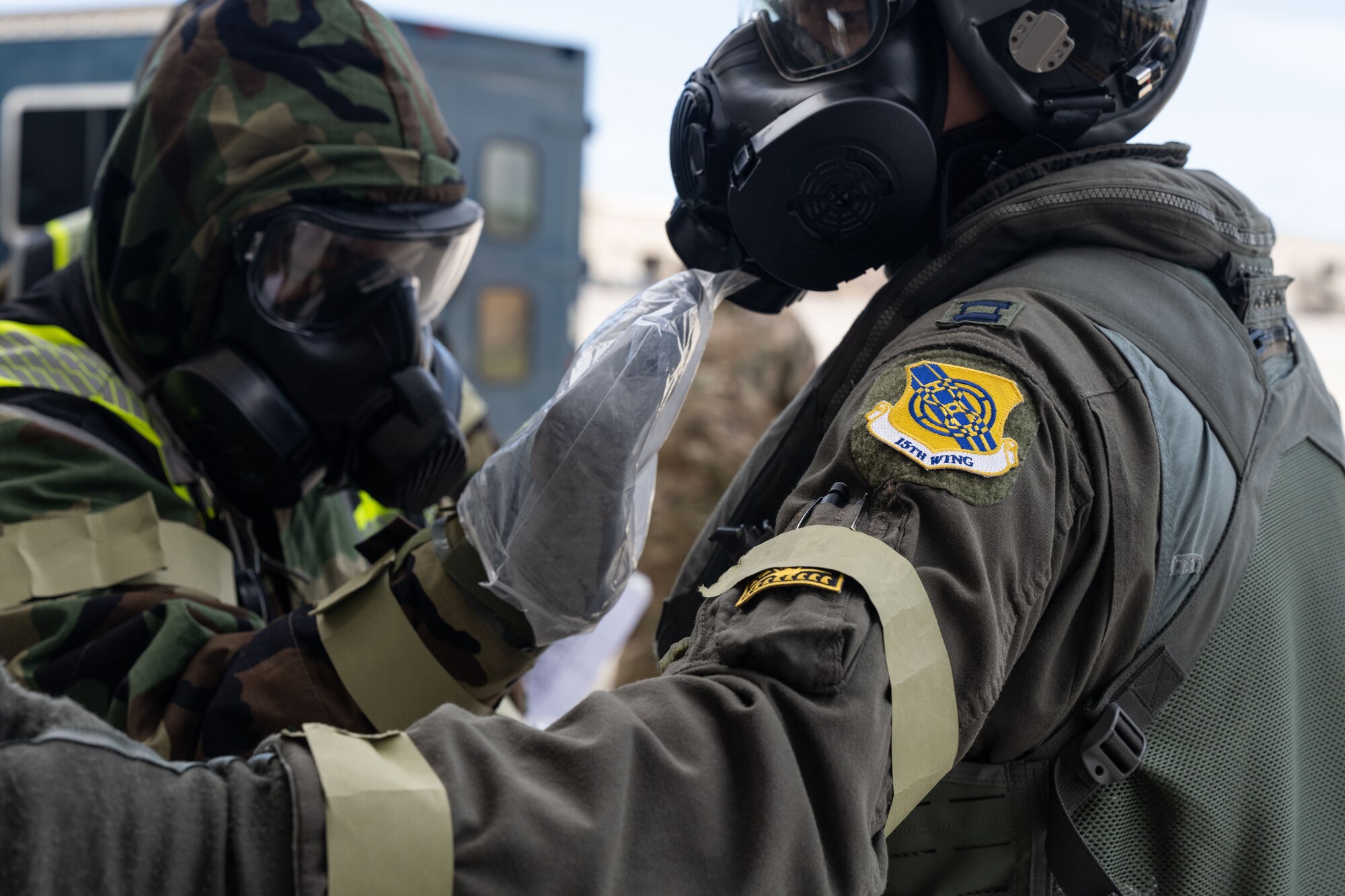 U.S. Air Force Capt. Alex “Doom” Moss, 19th Fighter Squadron F-22A Raptor pilot, utilizes the aircrew ensemble respiratory protection system while processing through the aircrew contamination control area during the Next Generation Aircrew Protection Step-Launch and Recover training event, Joint Base Pearl Harbor-Hickam, Hawaii, May 10, 2023. Throughout theStep-Launch and Recover training procedure for the F-22, all involved were notating any shortfalls or limiting factors for further examination. (U.S. Air Force photo by Tech. Sgt. Hailey Haux)