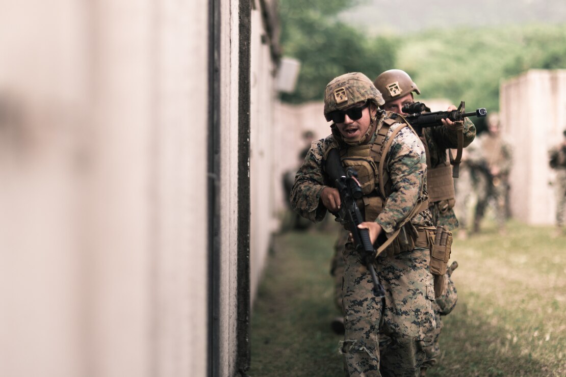 U.S. Marines with Combat Logistics Group 33, 3rd Marine Logistic Group, 3rd Marine Expeditionary Force, conduct urban operations training at Marine Corps Training Area Bellows, Hawaii, May 17, 2023. The purpose of the training was to increase readiness and operability in urban terrain. (U.S. Marine Corps photo by Cpl. Christian Tofteroo)