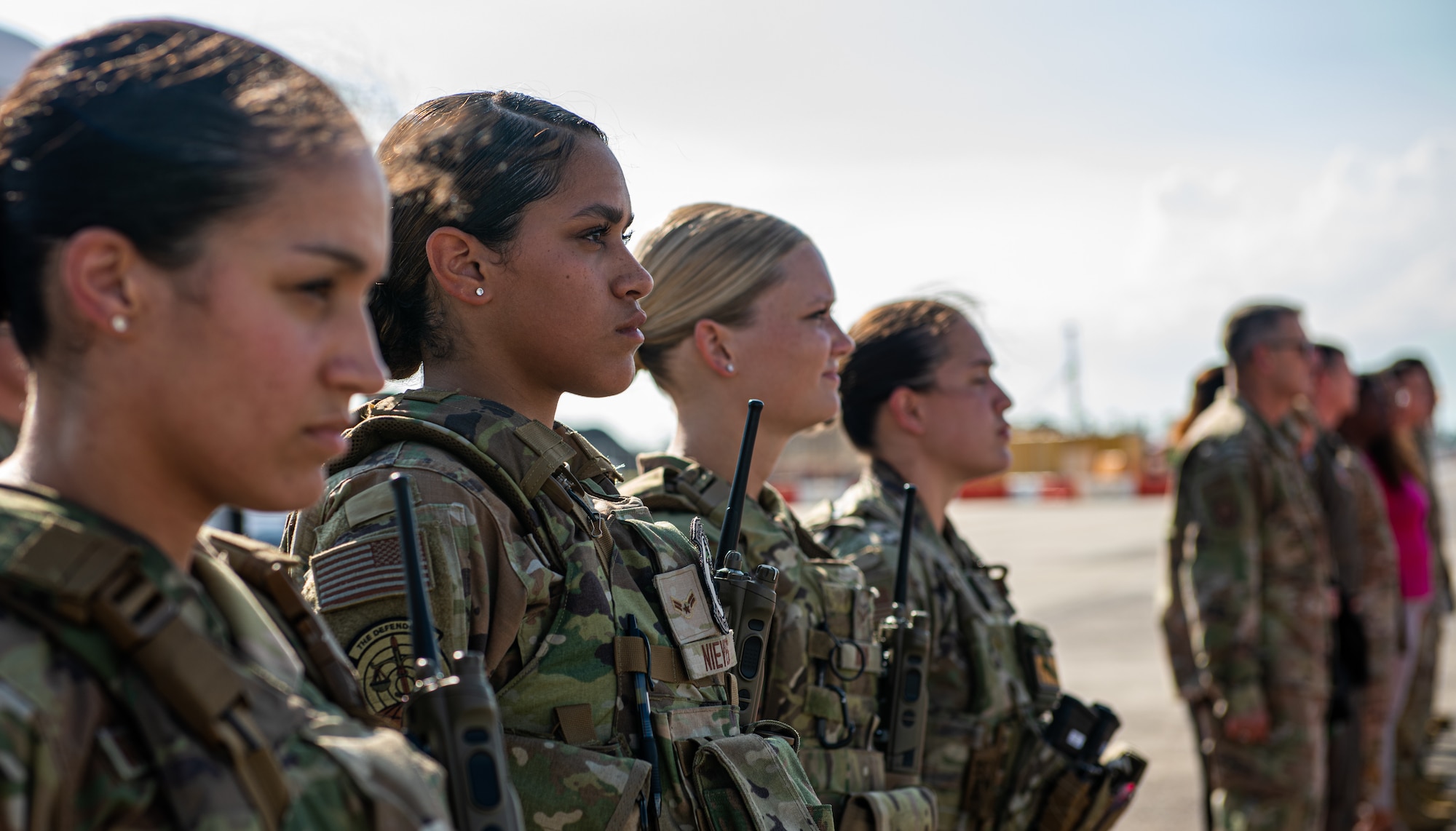 Airmen watch leadership board an aircraft