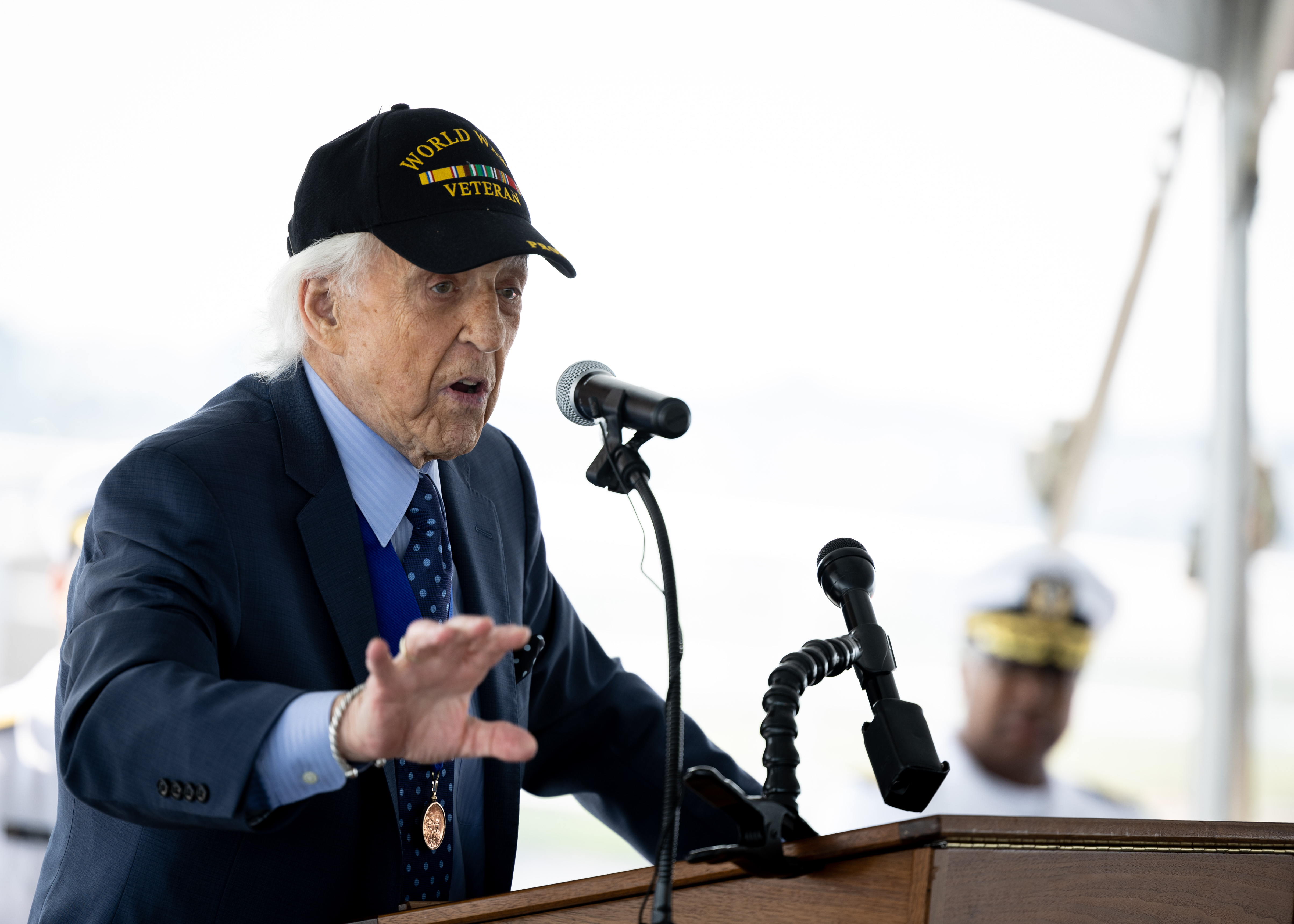 Dave Yoho, U.S. Merchant Marine and World War II Veteran, delivers remarks during Military Sealift Command’s National Maritime Day ceremony aboard USNS Comfort (T-AH 20) May 22, 2023. National Maritime Day honors the thousands of dedicated merchant mariners who served aboard United States vessels around the world.