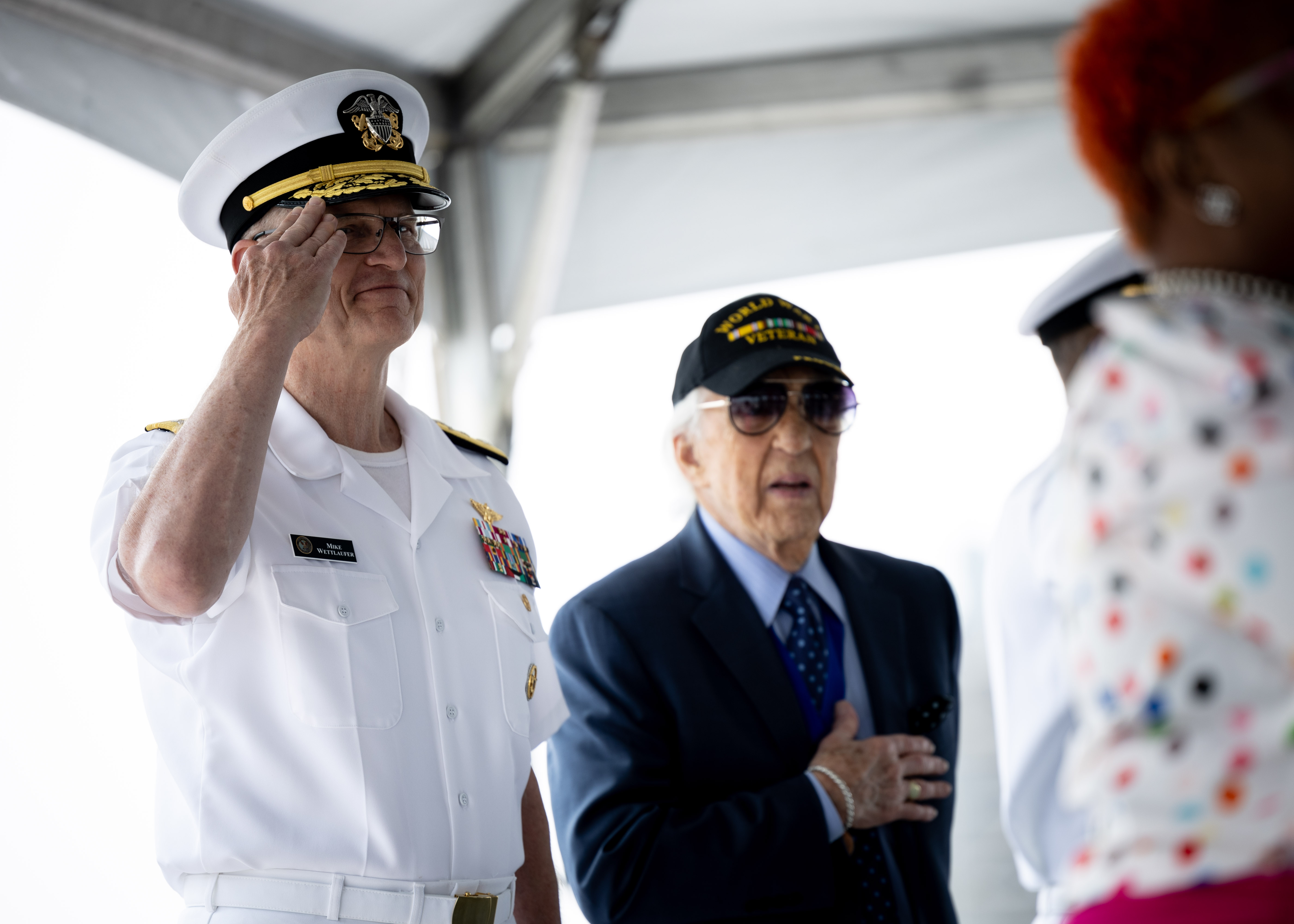 Rear Adm. Michael Wettlaufer, USN Commander, Military Sealift Command (MSC), salutes the National Ensign during MSC’s National Maritime Day ceremony aboard USNS Comfort (T-AH 20) May 22, 2023. National Maritime Day honors the thousands of dedicated merchant mariners who served aboard United States vessels around the world.