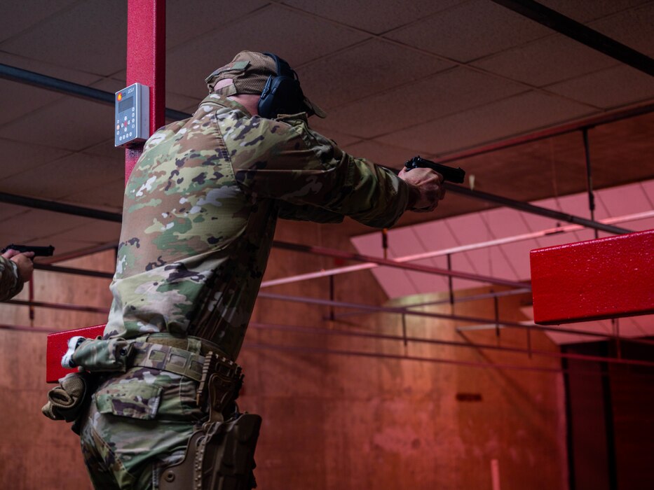 U.S. Air Force Staff Sgt. Alexander Klein, 56th Security Forces Squadron unit trainer, fires a Baretta M9 handgun, May 17, 2023, at Luke Air Force Base, Arizona.