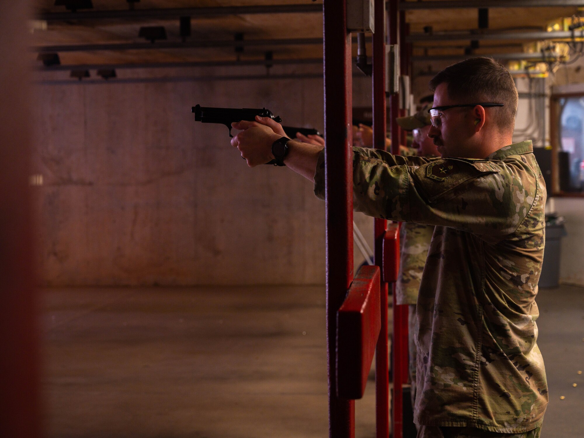 U.S. Air Force Staff Sgt. Casey Church 56th Security Forces Squadron noncommissioned officer in-charge of security forces armory, lines up with other 56th SFS members during a shooting competition, May 17, 2023, at Luke Air Force Base, Arizona.