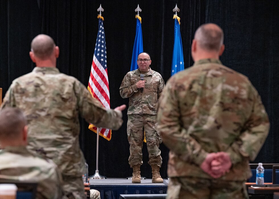 U.S. Air Force Col. Yaakov Bindell, deputy director, Air National Guard (ANG) Chaplain Corps, answers a question from the audience during the ANG Chaplain Corps Senior Religious Support Team Symposium in Arlington, Virginia, May 17, 2023.
