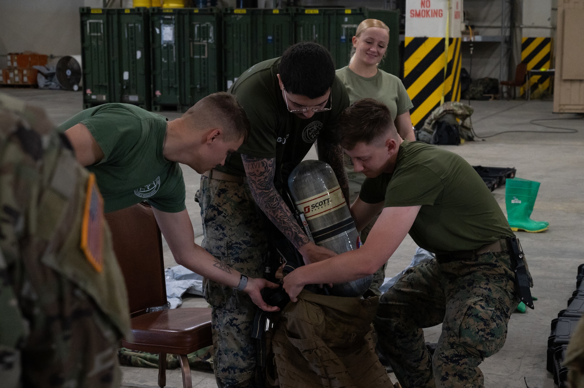 Marines pack a CBRN ruck sack.