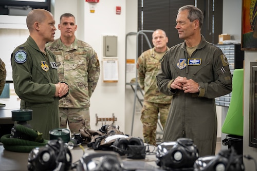 U.S. Air Force Col. Paul Hendrickson, Air Force Chemical, Biological, Radiological and Nuclear defense systems materiel leader (left) speaks to Gen. Ken Wilsbach, Pacific Air Forces commander, during a Next Generation Aircrew Protection Step-Launch and Recover demonstration at Joint-Base Pearl Harbor-Hickam, Hawaii, May 11, 2023. The team demonstrated the PACAF stop gap for the F-22 Aircrew CBRN limiting factor utilizing the modified M-50 ground crew mask and explained how these operationally relevant capabilities provide him commander’s decision superiority to generate combat sorties safely in a Chemical environment while maximizing aircrew performance. (U.S. Air National Guard photo by Master Sgt. Mysti Bicoy)
