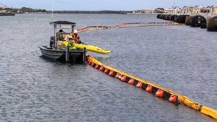 Joint Task Force-Red Hill (JTF-RH) contractors retrieve a kayak after performing a survey of Hotel Pier on Joint Base Pearl Harbor-Hickam, Hawaii, May 16, 2023. JTF-RH is in phase three of its five-phase defueling plan. Personnel are focused on completing repairs, quality control tasks, training, response preparation, the National Environmental Policy Act Environmental Assessment, regulatory approvals and operational planning for all major milestones. This extensive preparatory work will help ensure the safe and expeditious defueling of the Red Hill Bulk Fuel Storage Facility. (DoD photo by U.S. Army Sgt. Kyler L. Chatman)