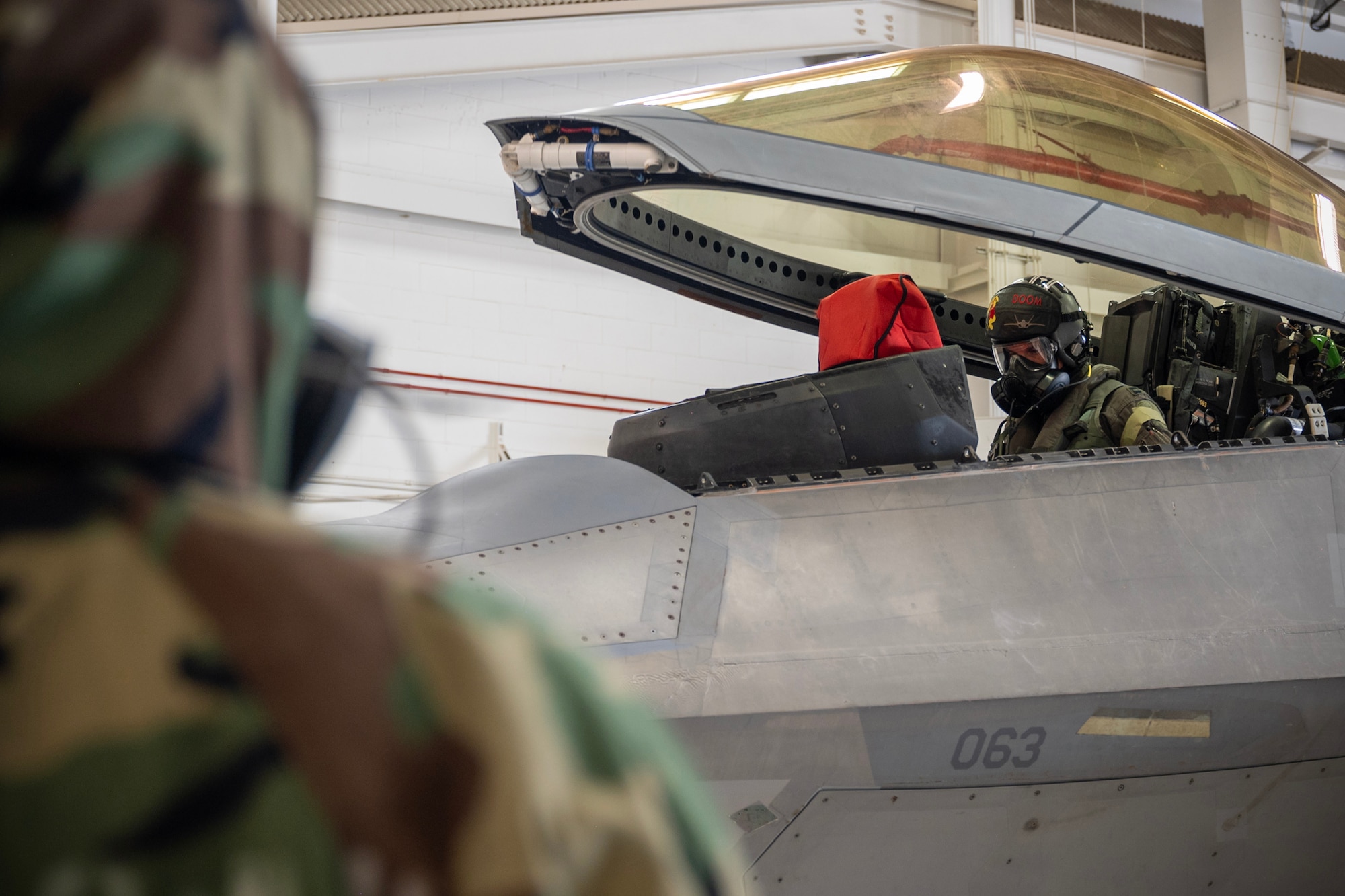 U.S. Air Force Capt. Alex “Doom” Moss, 19th Fighter Squadron F-22 Raptor pilot, utilizes the modified M-50 ground crew mask during a Next Generation Aircrew Protection Step-Launch and Recover concept of operation demonstration, Joint-Base Pearl Harbor-Hickam, Hawaii, May 11, 2023. The demonstration showcases the Pacific Air Forces stop gap for the F-22 Aircrew Chemical, Biological, Radiological and Nuclear limiting factor utilizing the modified M-50 ground crew mask. (U.S. Air National Guard photo by Master Sgt. Mysti Bicoy)