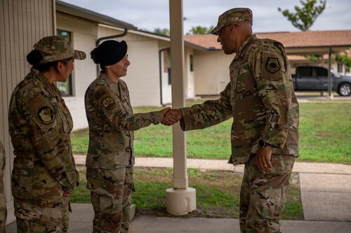 Airmen shake hands after meeting