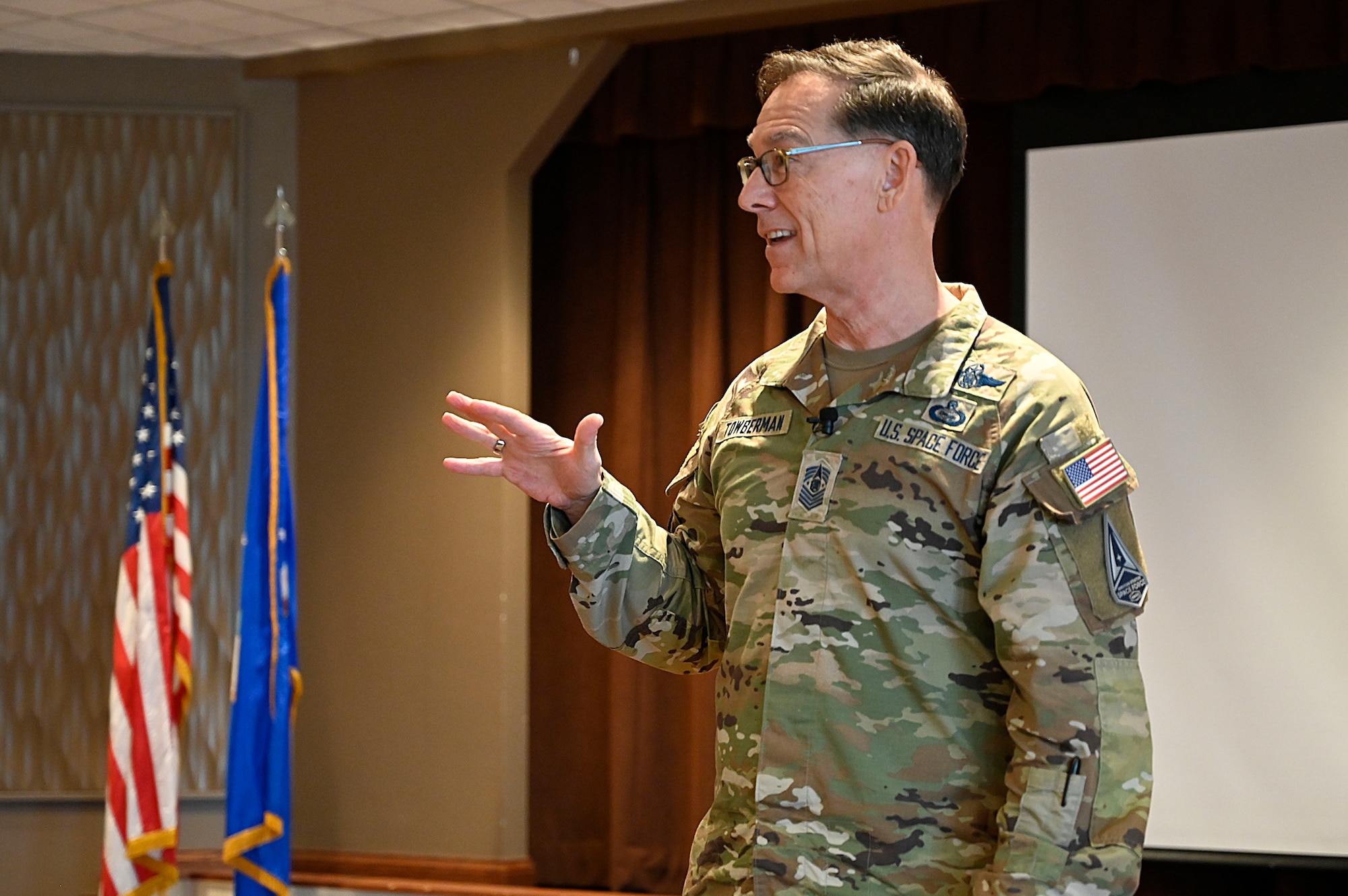 Chief Master Sgt. Roger A. Towberman, Space Force, speaking at a training symposium.