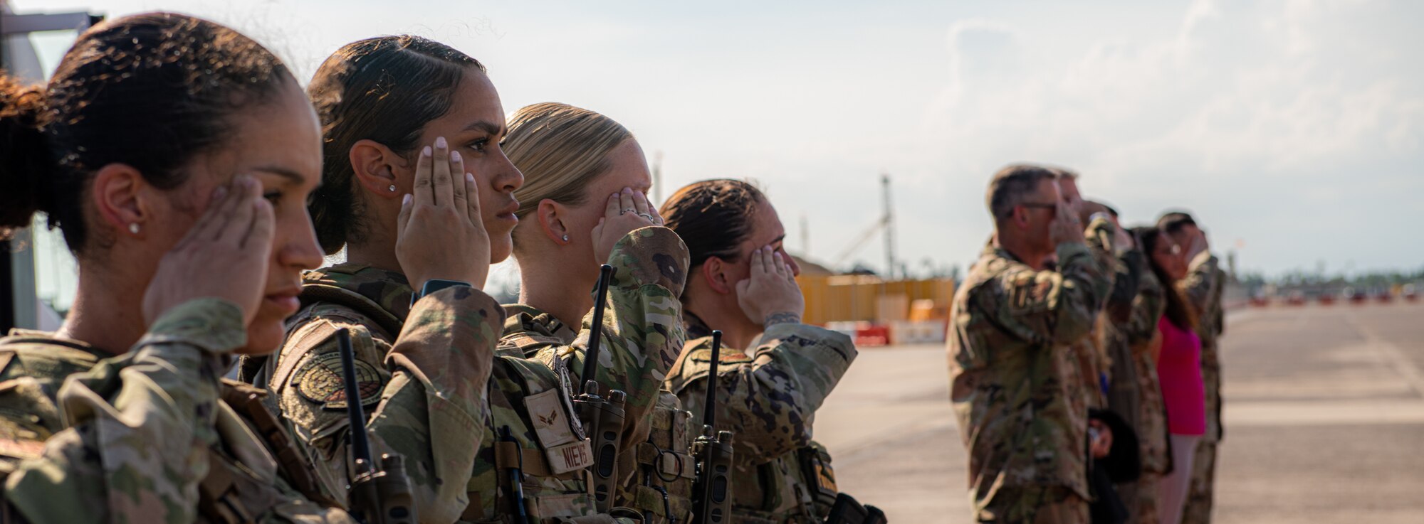 Airmen salutes a plane