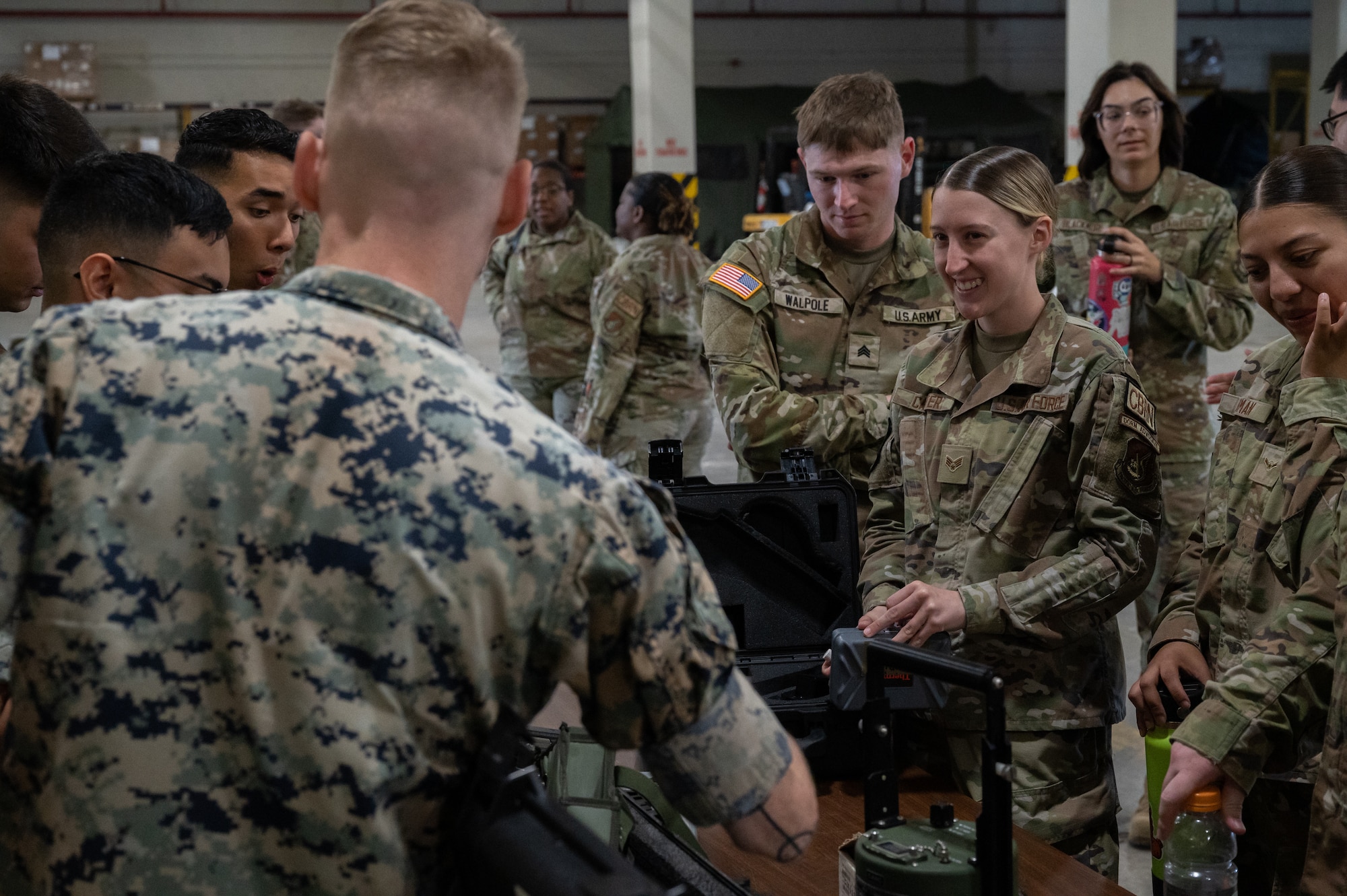 Airmen, Soldiers and Marines have a show-and-tell on CBRN equipment.