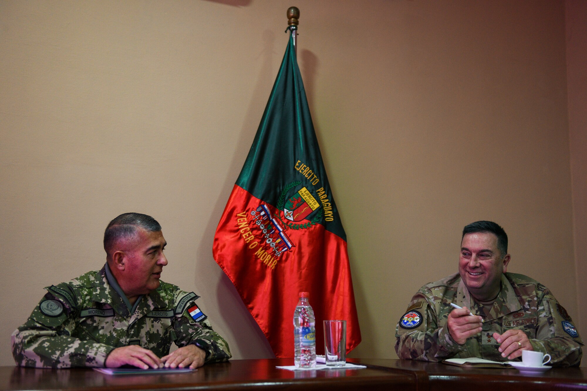 U.S. Air Force Maj. Gen. Gary Keefe, the adjutant general of Massachusetts, speaks with Paraguayan army Gen. Cesar A. Moreno, the Paraguayan Army commander, during a State Partnership Program event in Asunción, Paraguay, May 18, 2023.