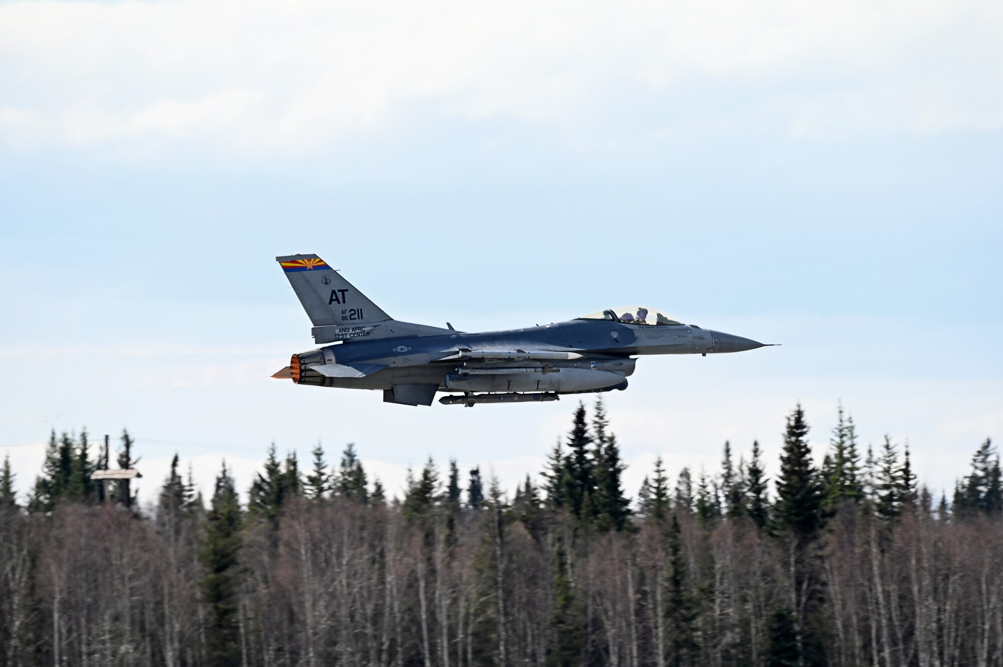 An F-16 Fighting Falcon assigned to the Air National Guard Air Force Reserve Command Test Center launches at Eielsen Air Force Base, Alaska, May 9, 2023, during Northern Edge 2023. AATC aircraft tested the “angry kitten” combat pod, an electronic warfare countermeasure that can be housed in removable, adaptable pods under aircraft wings or fuselages.